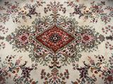 an image of a large oriental rug on a wooden floor