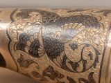 a close up of a vase with a design on it