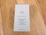 an empty box of skinceuticals on a wooden table