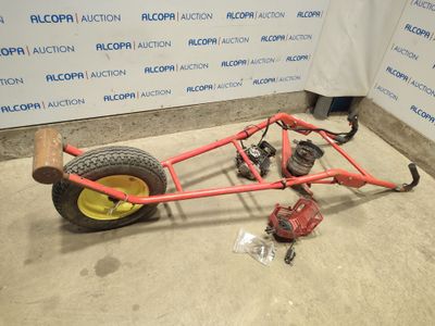 an image of a car with a big wheel on the ground