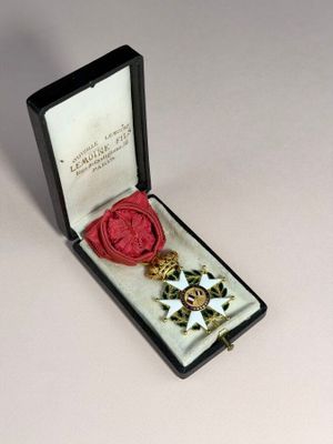an image of a medal in a case with a red wax seal
