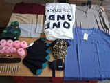 a pile of clothes and other items on a table