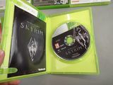 someone is holding a green case with a dvd in it