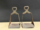 pair of antique brass figurines of a man and a woman