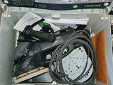 a box with a corded sander and a corded sander in it