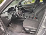 the interior of a car with a steering wheel and a dashboard