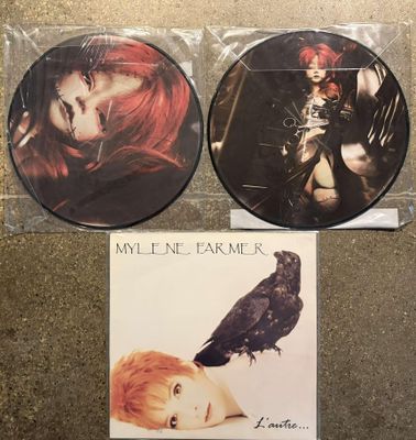 two cd ' s with a picture of a woman and a bird on them