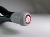 a bottle of wine that is sitting on a table