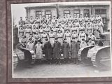 a black and white photo of a group of men in uniform