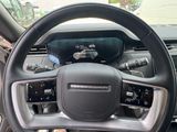 the interior of a car with a steering wheel and dashboard controls