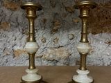 two candles that are sitting on a table