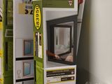 a stack of boxes of windows in a store