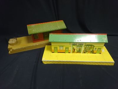 two toy buildings that are sitting on a table