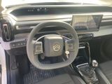 a picture of a car dashboard with a steering wheel