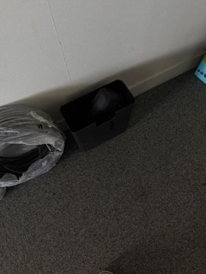a bag of luggage sitting on the floor next to a wall