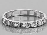 a close up of a diamond ring on a reflective surface