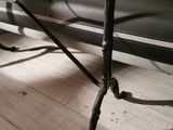 a bench that is sitting on the floor in a room