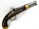 a close up of a gun that is on a white surface