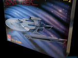 a box with a model of a star trek ship on it
