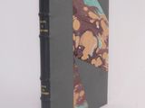 a book that is sitting on a white surface