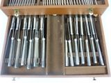 a wooden box with a bunch of knives and spoons in it