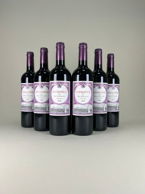 six bottles of wine are lined up on a table