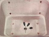 a dirty bath tub with a spout in it