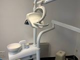 a blue chair and a blue table in a dentist ' s office