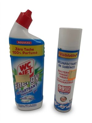 a close up of a bottle of cleaner and a spray of cleaner