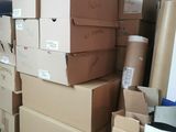 many boxes stacked on top of each other in a room