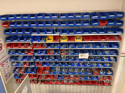 many bins of assorted tools on the shelves