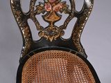 an image of a chair with a floral design on the back of it