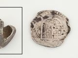 une image représentant une pièce d'argent sur laquelle figure un château
