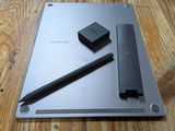 a pen and a pencil sitting on top of a laptop