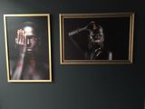 two pictures hanging on the wall above a toilet