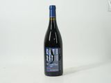 a bottle of wine that is sitting on a table