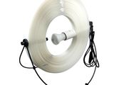 an image of a large roll of white flexible wire