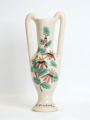 a white vase with a painting of birds on it