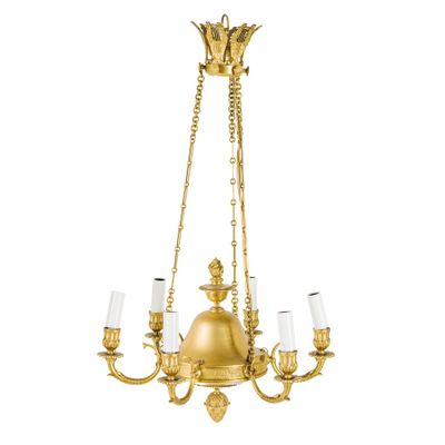 a brass chandelier with five lights and a chain