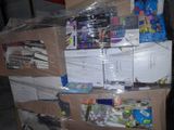 a large pile of supplies on top of a carton