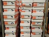 many boxes of shoes stacked on a rack in a warehouse