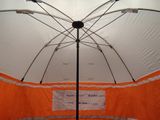 an orange and white tent with a white umbrella