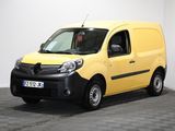 the small yellow van is parked in a room with a checkered floor