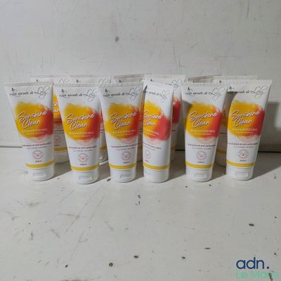 four tubes of hand creams are lined up on a counter