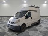 a white van that is parked on a checkered floor