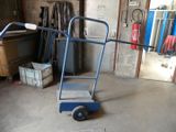 a blue hand truck with a ladder in a garage