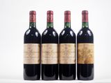trois bouteilles de vin rouge sont alignées sur une surface blanche