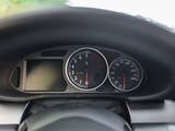 a close up of a car dashboard with a speedometer and gauges