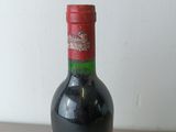 a bottle of wine that is sitting on a table