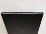 a close up of a laptop computer on a white surface